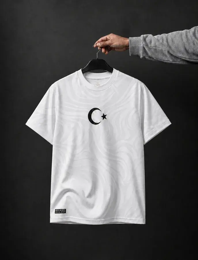 T&uuml;rkiye Football Jersey by AEVO — white shirt with tonal swirl pattern and black crescent and star crest